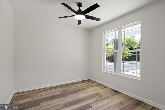 unfurnished room with ceiling fan and light hardwood / wood-style flooring