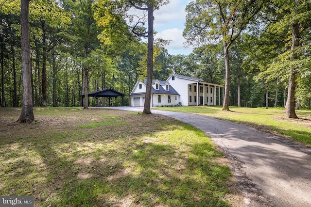 view of front of house featuring a garage and a front yard