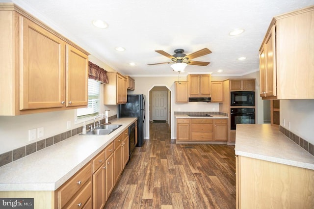 kitchen featuring ceiling fan, a sink, dark wood-style floors, black appliances, and crown molding