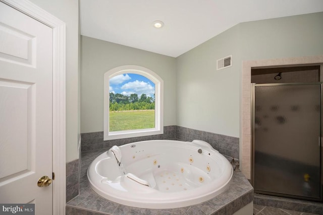 full bath with visible vents, a shower stall, and a whirlpool tub