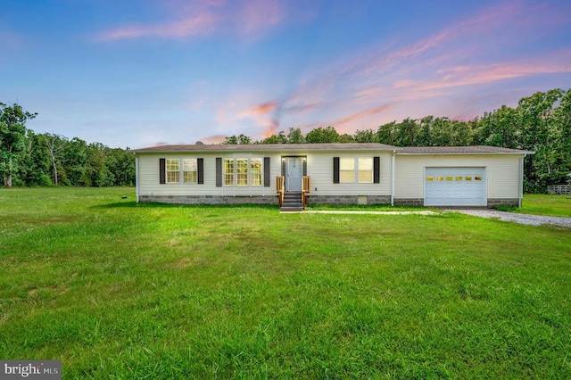 view of front of house featuring crawl space, driveway, a garage, and a front lawn