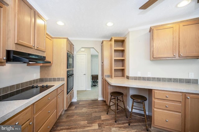 kitchen with arched walkways, ornamental molding, dark wood-style flooring, under cabinet range hood, and black appliances