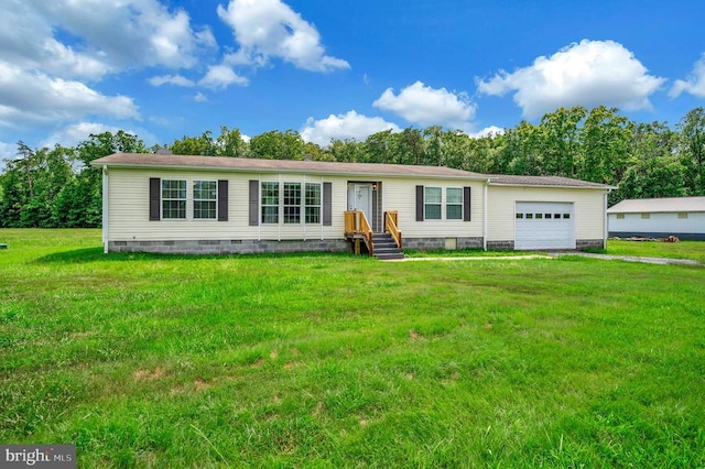 manufactured / mobile home featuring a garage, crawl space, and a front yard