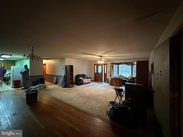 living room featuring ceiling fan and hardwood / wood-style floors