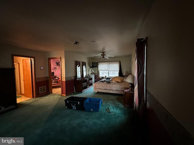 interior space with light carpet and ceiling fan