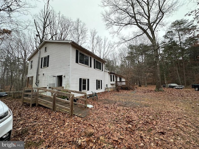 view of side of property with a wooden deck