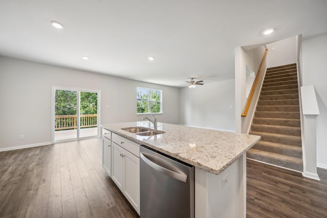 kitchen with sink, white cabinetry, light stone counters, a center island with sink, and stainless steel dishwasher