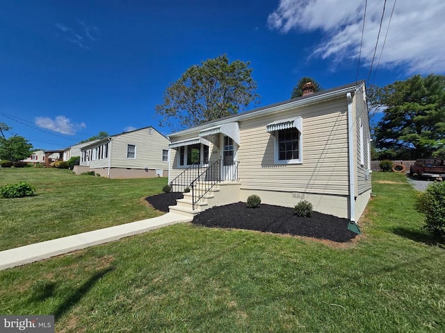 view of front of property with a front lawn and a chimney