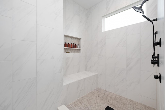 full bathroom with a tile shower