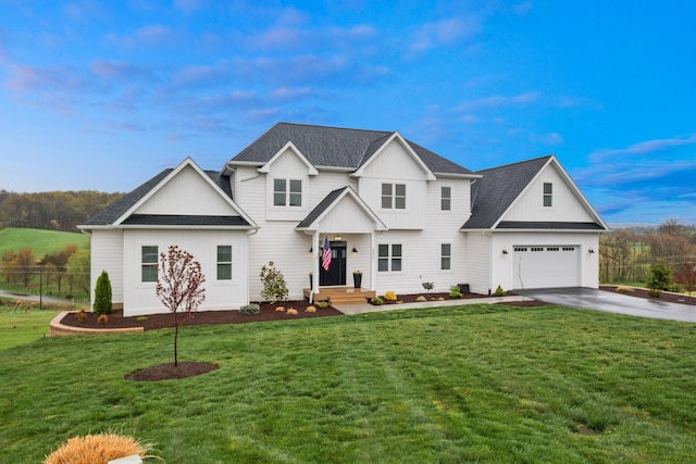 view of front of home with a front yard, a garage, driveway, board and batten siding, and fence
