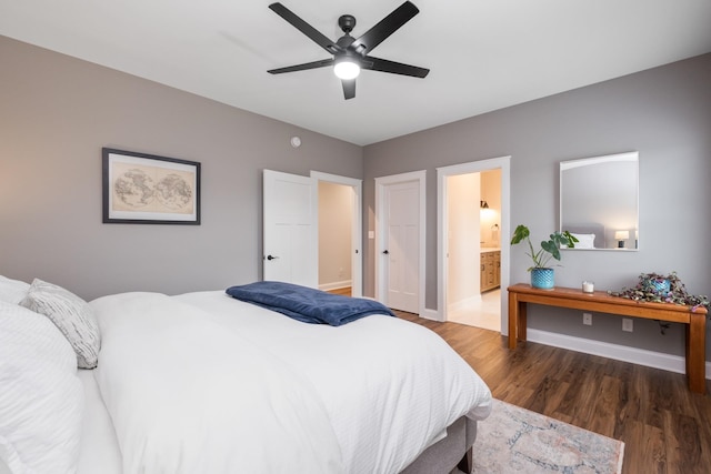 bedroom featuring baseboards, wood finished floors, a ceiling fan, and ensuite bathroom