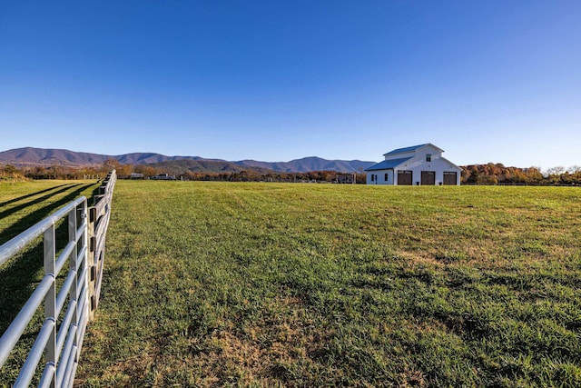 view of yard featuring a mountain view and a rural view