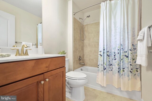 full bathroom with tile patterned floors, shower / bath combo, toilet, and vanity