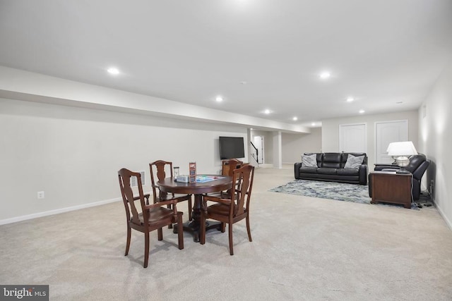 dining room featuring light carpet