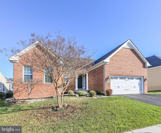 view of front of house featuring a garage and a front yard