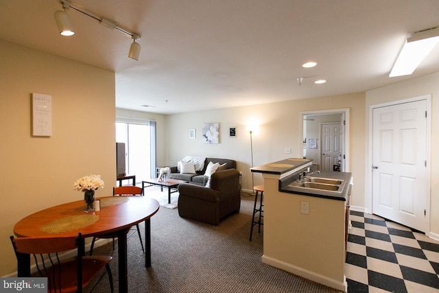 living room featuring sink and track lighting