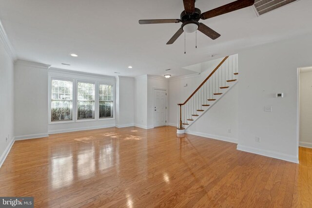 unfurnished living room with ornamental molding, ceiling fan, and light hardwood / wood-style floors