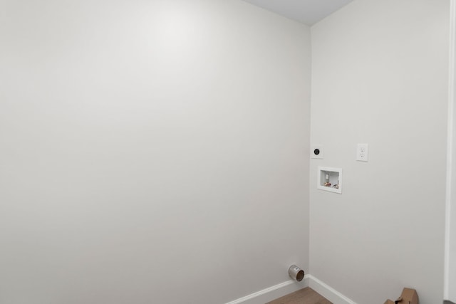 clothes washing area featuring laundry area, hookup for an electric dryer, baseboards, and washer hookup