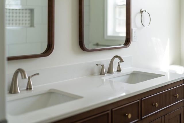 bathroom featuring double vanity and a sink