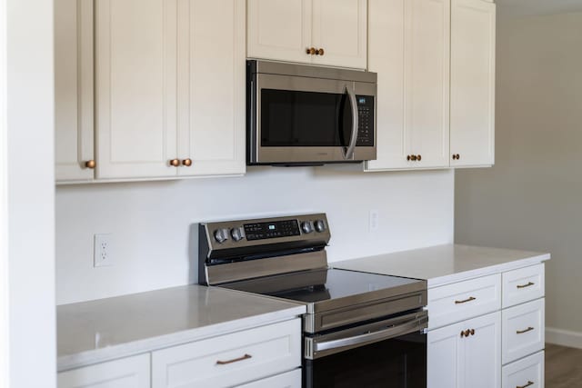 kitchen featuring white cabinetry and stainless steel appliances