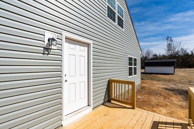 property entrance with a wooden deck