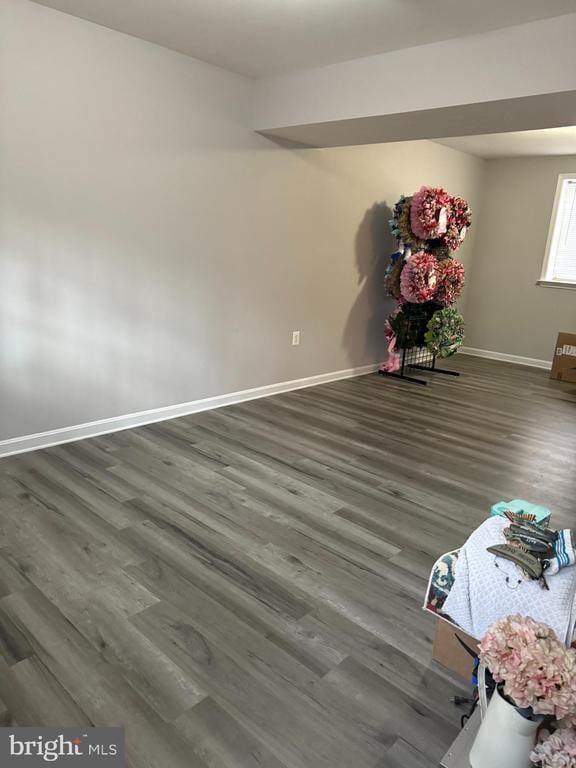 unfurnished room featuring dark hardwood / wood-style floors