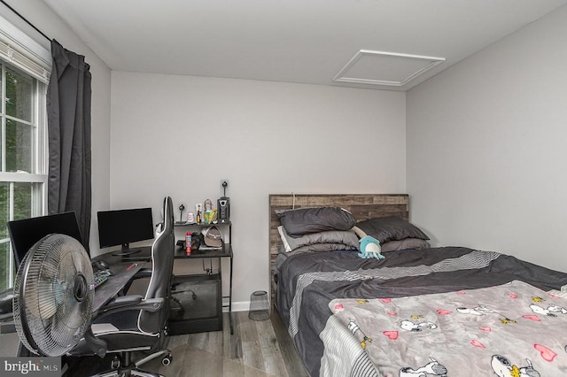 bedroom with wood-type flooring