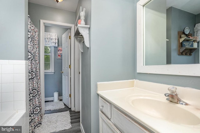 bathroom featuring vanity and hardwood / wood-style floors