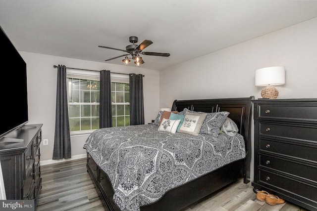 bedroom featuring ceiling fan and light wood-type flooring