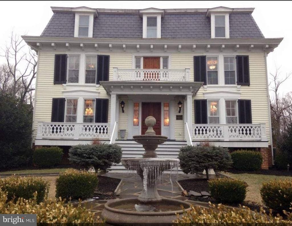 view of front of house featuring a balcony