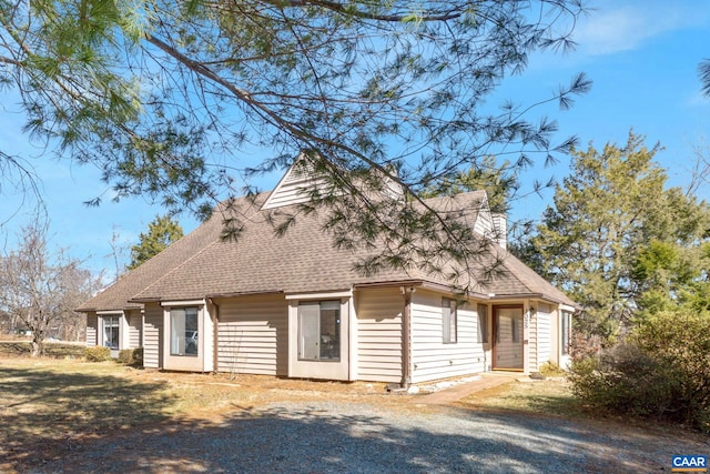 view of front of house with a shingled roof