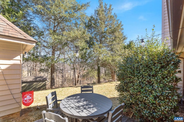 view of patio featuring outdoor dining area