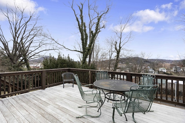 wooden deck with outdoor dining space