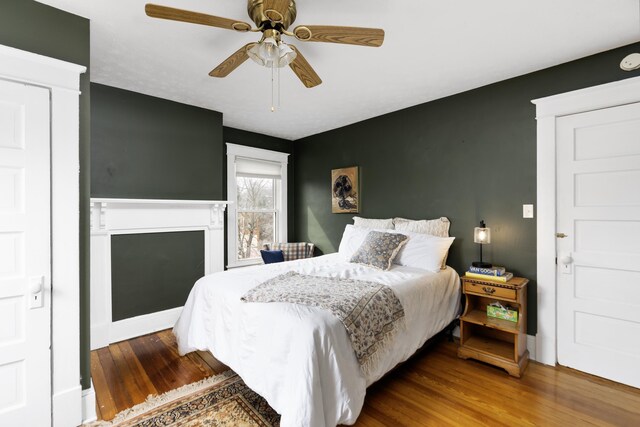 bedroom with wood finished floors and ceiling fan