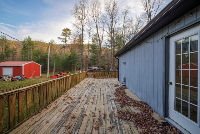 wooden terrace with an outdoor structure