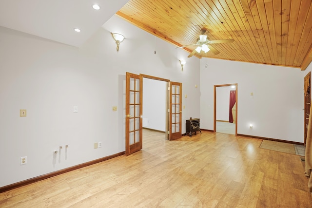 empty room featuring ceiling fan, wooden ceiling, light wood-type flooring, and french doors