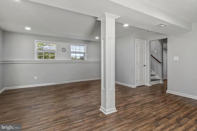 below grade area featuring recessed lighting, baseboards, stairs, and wood finished floors
