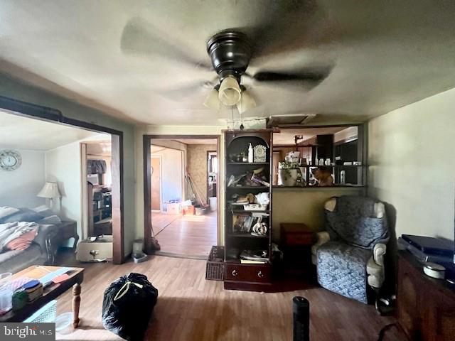 interior space featuring ceiling fan and hardwood / wood-style floors