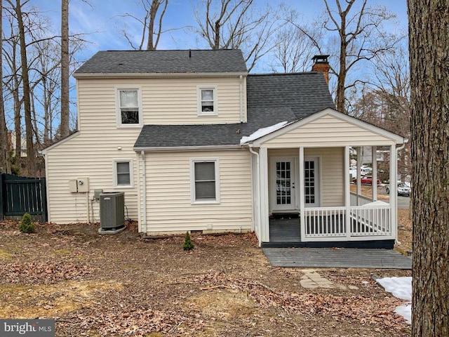 back of property featuring central air condition unit and a porch