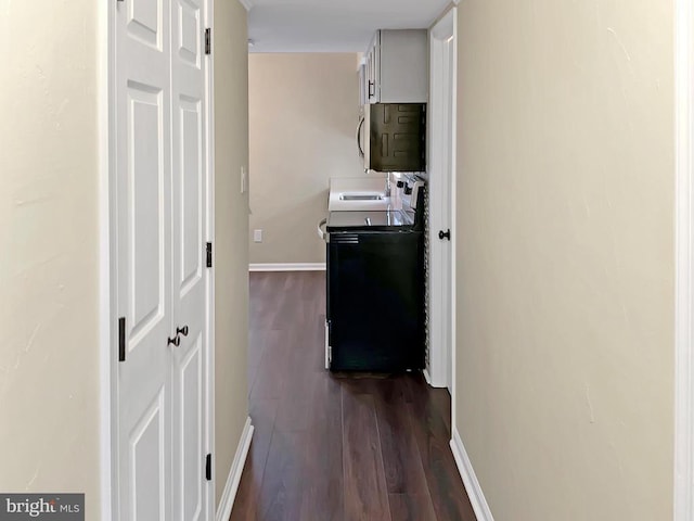 corridor with dark wood-type flooring