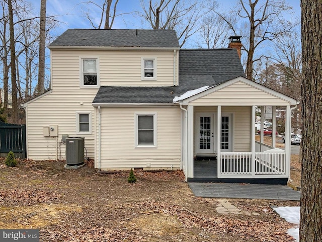 back of property with central air condition unit and a porch