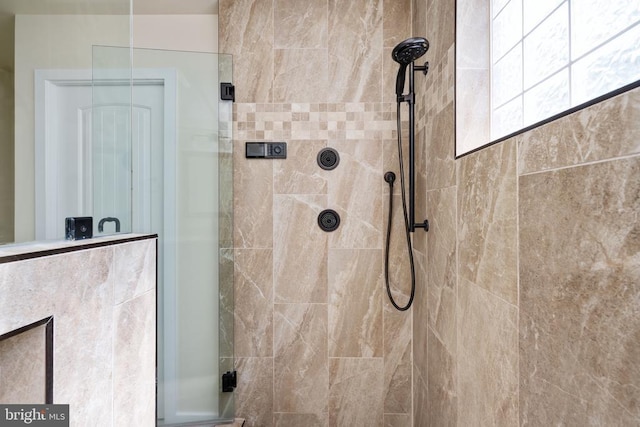 full bathroom with tiled shower