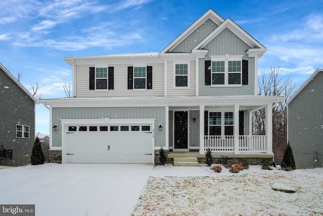 view of front of home with board and batten siding, driveway, and an attached garage