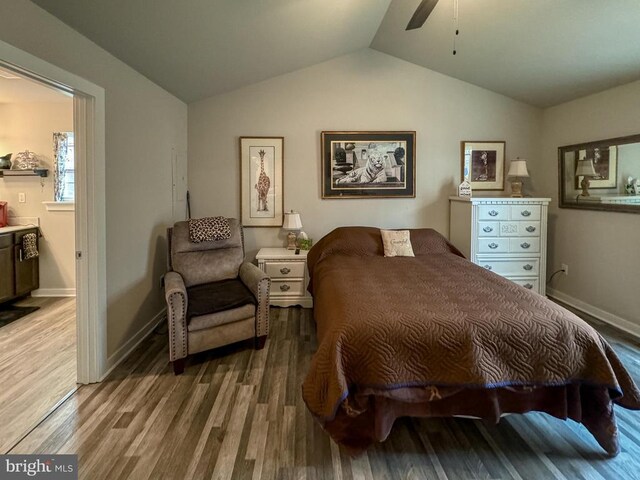 bedroom with hardwood / wood-style flooring, lofted ceiling, and ceiling fan