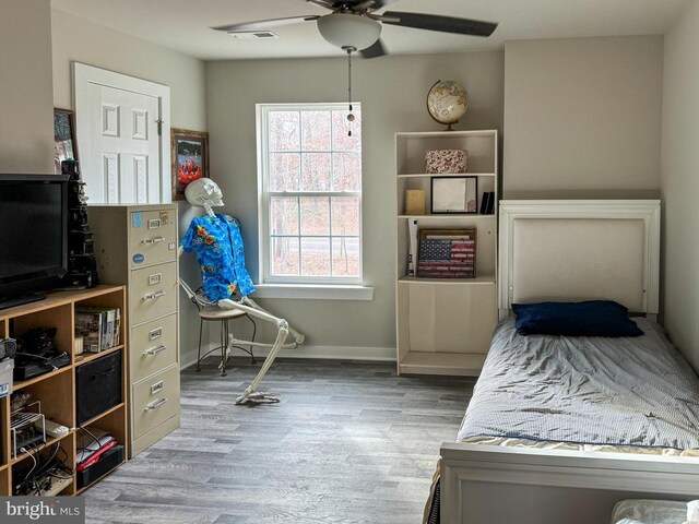 bedroom featuring ceiling fan and wood-type flooring