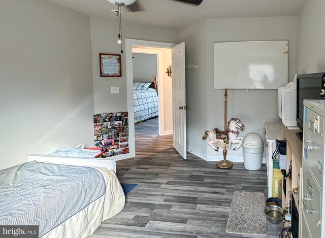 bedroom featuring dark wood-type flooring