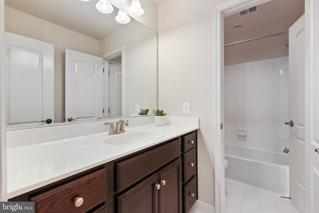 full bathroom with tile patterned flooring, toilet, visible vents, vanity, and washtub / shower combination