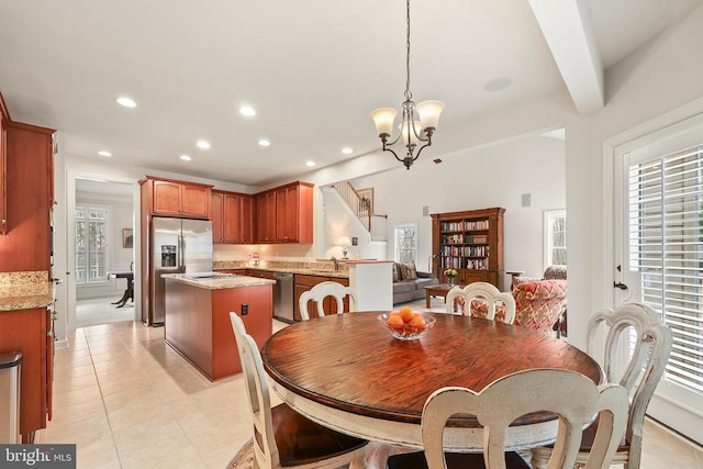 dining room with a chandelier, recessed lighting, beam ceiling, and light tile patterned floors