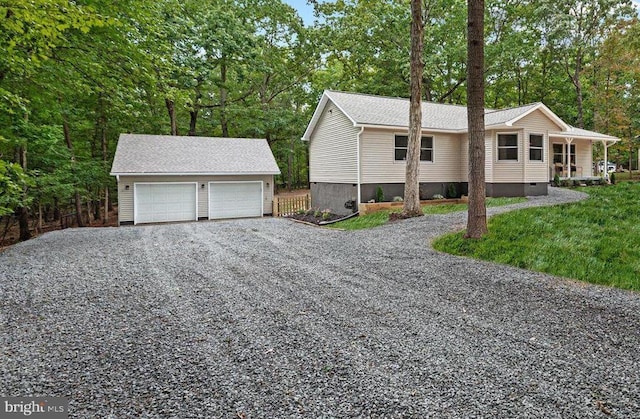 view of front of property featuring an outbuilding and a detached garage