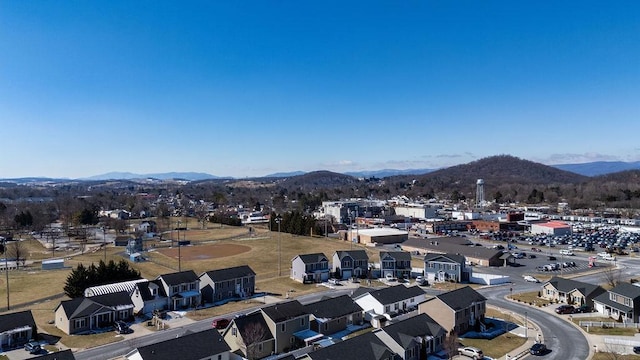 drone / aerial view featuring a residential view and a mountain view